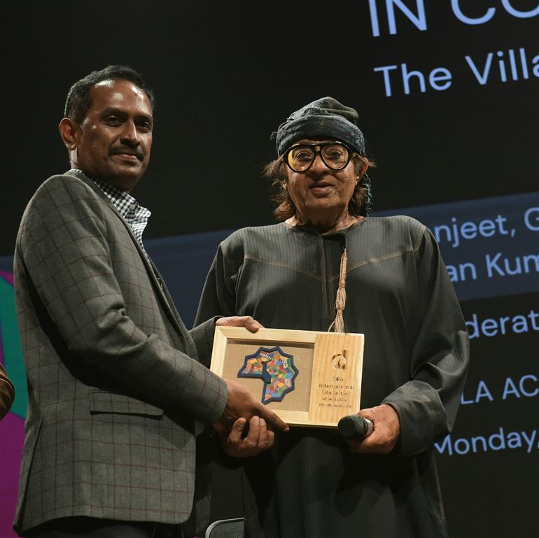 Bollywood Actor, Ranjeet felicitated at the in-conversation session on "The Villains: Leaving a Lasting Impression", at the 54th IFFI, in Goa on November 27, 2023.