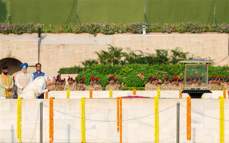 PM paying homage  at the Samadhi of Mahatma Gandhi on the occasion of Gandhi Jayanti at Rajghat, in New Delhi on October 02, 2023.