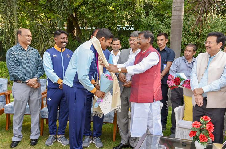 The Union Minister for Tribal Affairs, Shri Arjun Munda confers to medal-winning Indian Archery contingent from Asian Games at his residence, in New Delhi on October 10, 2023.