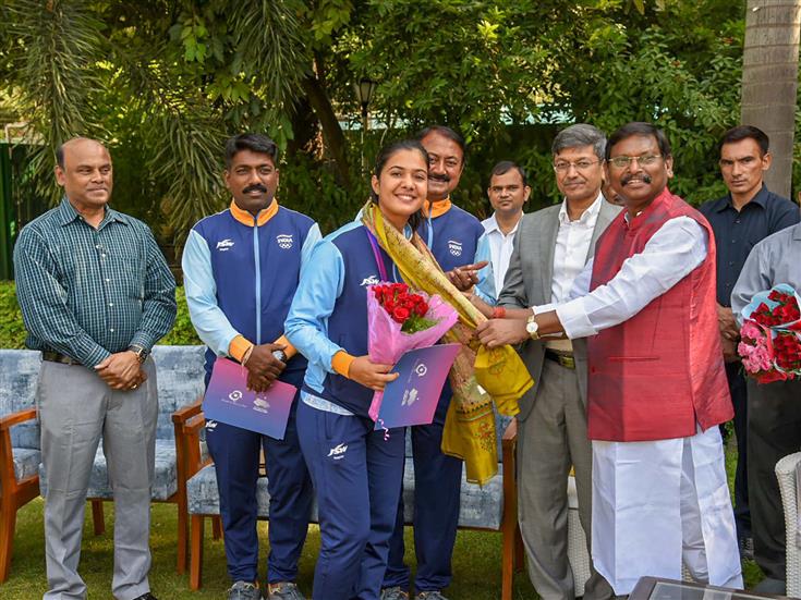 The Union Minister for Tribal Affairs, Shri Arjun Munda confers to medal-winning Indian Archery contingent from Asian Games at his residence, in New Delhi on October 10, 2023.