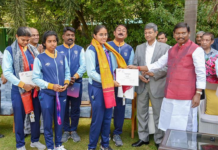 The Union Minister for Tribal Affairs, Shri Arjun Munda confers to medal-winning Indian Archery contingent from Asian Games at his residence, in New Delhi on October 10, 2023.