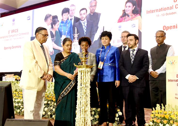 The Chairperson, Competition Commission of India (CCI), Ms. Ravneet Kaur lighting the lamp at 8th Brics International Competition Conference, in New Delhi on October 12, 2023.