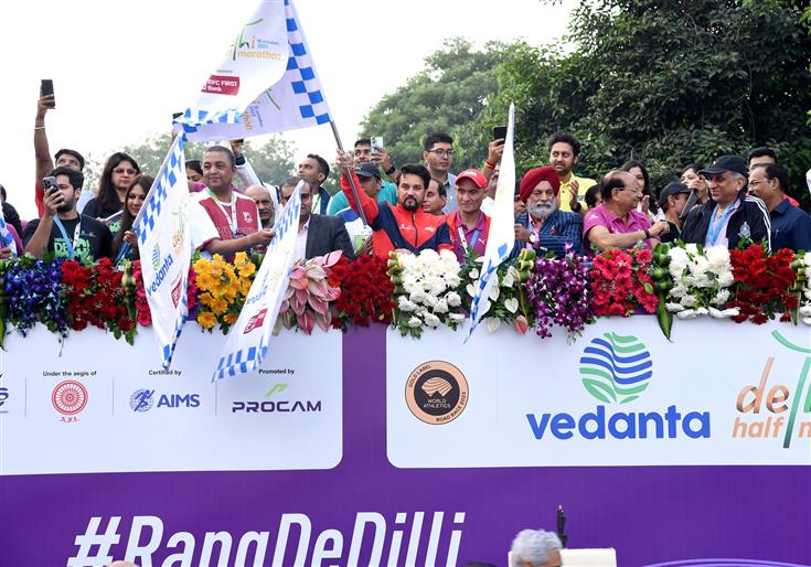 The Union Minister for Information & Broadcasting, Youth Affairs and Sports, Shri Anurag Singh Thakur flags off 'Vedanta Delhi Half Marathon' at Jawaharlal Nehru Stadium, in New Delhi on October 15, 2023.