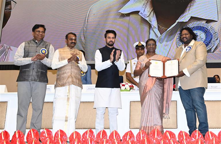 The President of India, Smt Droupadi Murmu confers Shri Srikanth Deva for best Music Director at the 69th National Film Awards ceremony, in New Delhi on October 17, 2023.