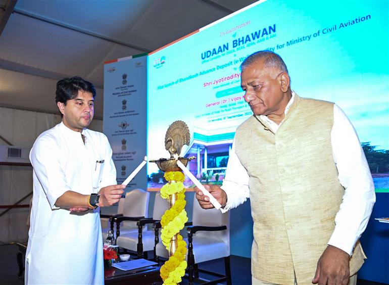 The Union Minister of Steel and Civil Aviation, Shri Jyotiraditya M. Scindia and the Minister of State for Road Transport & Highways and Civil Aviation, General (Retd.) V.K. Singh lighting the lamp at the Udaan Bhawan & Bharatkosh E-Wallet inauguration and launch event at Safdarjung Airport, in New Delhi on September 18, 2023.