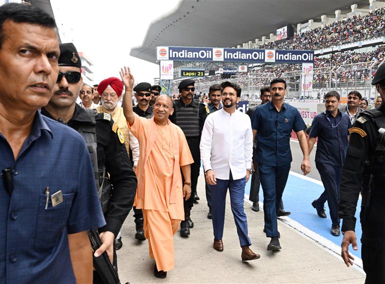 The Union Minister for Information & Broadcasting, Youth Affairs and Sports, Shri Anurag Singh Thakur, the Union Minister for Petroleum & Natural Gas, Housing and Urban Affairs, Shri Hardeep Singh Puri and the Chief Minister of Uttar Pradesh, Yogi Adityanath at the MotoGP Grand Prix 2023 in Buddh International Circuit, Greater Noida on September 24, 2023.