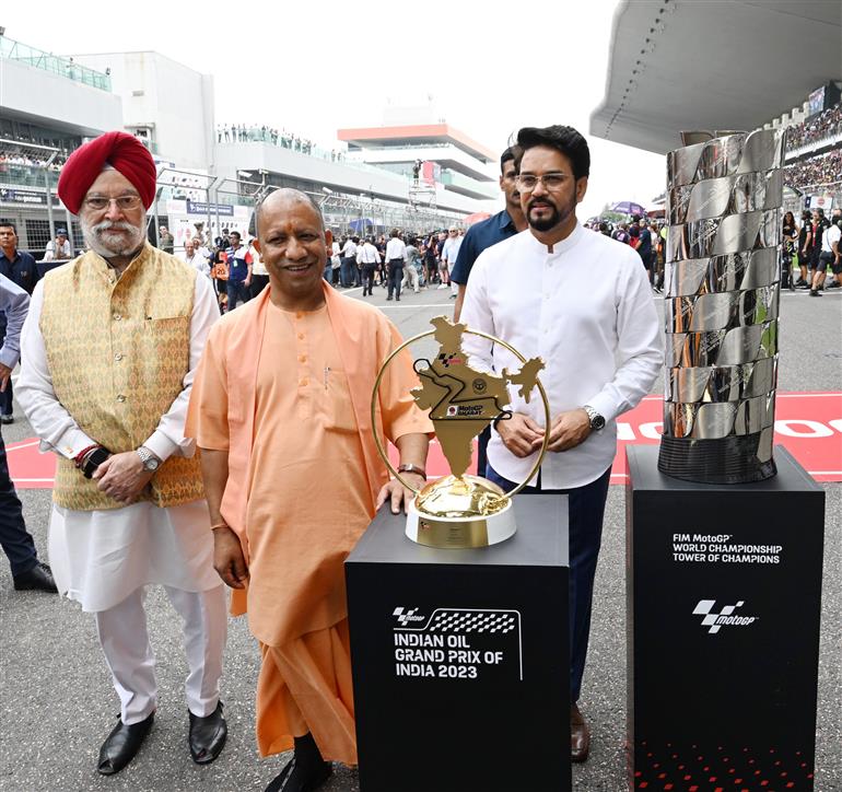 The Union Minister for Information & Broadcasting, Youth Affairs and Sports, Shri Anurag Singh Thakur, the Union Minister for Petroleum & Natural Gas, Housing and Urban Affairs, Shri Hardeep Singh Puri and the Chief Minister of Uttar Pradesh, Yogi Adityanath at the MotoGP Grand Prix 2023 in Buddh International Circuit, Greater Noida on September 24, 2023.