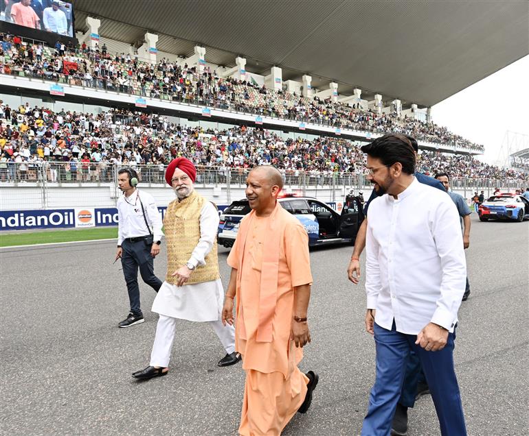 The Union Minister for Information & Broadcasting, Youth Affairs and Sports, Shri Anurag Singh Thakur, the Union Minister for Petroleum & Natural Gas, Housing and Urban Affairs, Shri Hardeep Singh Puri and the Chief Minister of Uttar Pradesh, Yogi Adityanath at the MotoGP Grand Prix 2023 in Buddh International Circuit, Greater Noida on September 24, 2023.