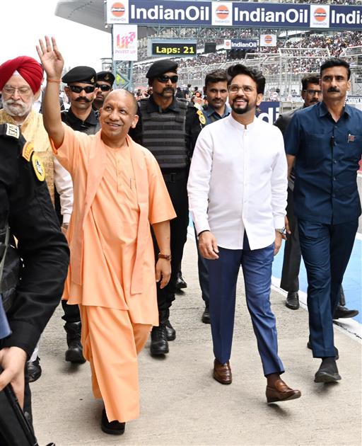 The Union Minister for Information & Broadcasting, Youth Affairs and Sports, Shri Anurag Singh Thakur, the Union Minister for Petroleum & Natural Gas, Housing and Urban Affairs, Shri Hardeep Singh Puri and the Chief Minister of Uttar Pradesh, Yogi Adityanath at the MotoGP Grand Prix 2023 in Buddh International Circuit, Greater Noida on September 24, 2023.