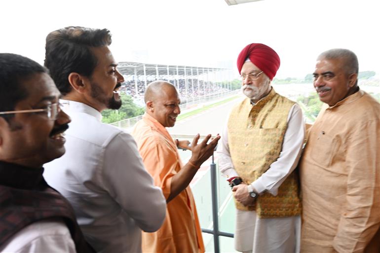The Union Minister for Information & Broadcasting, Youth Affairs and Sports, Shri Anurag Singh Thakur, the Union Minister for Petroleum & Natural Gas, Housing and Urban Affairs, Shri Hardeep Singh Puri and the Chief Minister of Uttar Pradesh, Yogi Adityanath at the MotoGP Grand Prix 2023 in Buddh International Circuit, Greater Noida on September 24, 2023.