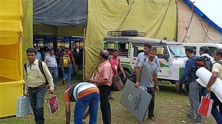 Polling officials checking the Electronic Voting Machine (EVMs) and other election related material required for the General Elections-2024 at the distribution center, Parimal Mitra Smriti Mahavidyalaya, Malbazar at Jalpaiguri, in West Bengal on April 18, 2024.