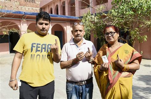 Voters showing mark of indelible ink after casting their votes at a polling booth during the 1st Phase of General Elections-2024 at Adarsh Navbalika Middle School (Gaya), in Bihar on April 19, 2024.