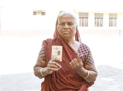 An elderly woman voter showing mark of indelible ink after casting her vote, at a polling booth, during the 1st Phase of General Elections-2024 at Kendriya Vidyalaya No.1, Bageshwari Road, Gaya, in Bihar on April 19, 2024.