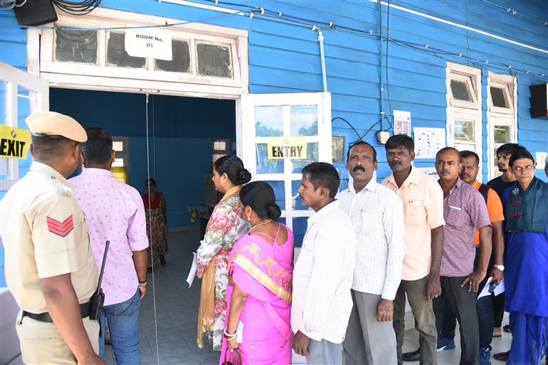 A voters standing in the queue to cast their votes, at a polling booth, during the 1st Phase of General Elections-2024 at Jawaharlal Nehru Rajkeeya Mahavidyalaya Port Blair, in Andaman and Nicobar Islands on April 19, 2024.