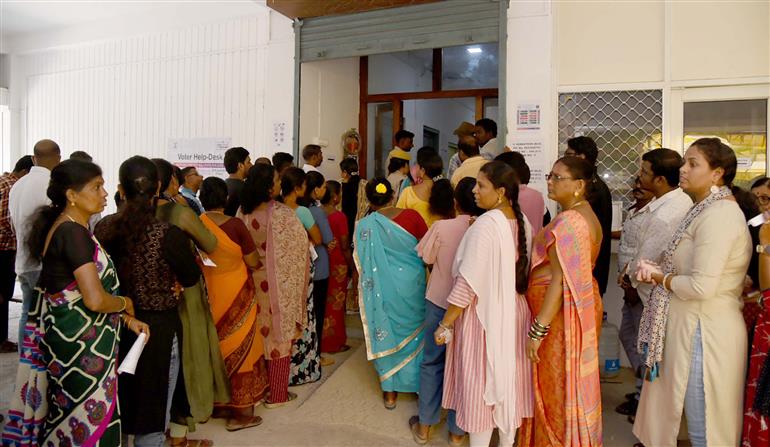 A voters standing in the queue to cast their votes, at a polling booth, during the 1st Phase of General Elections-2024 at Van Vikas Bhawan Haddo, Port Blair, in Andaman and Nicobar Islands on April 19, 2024.