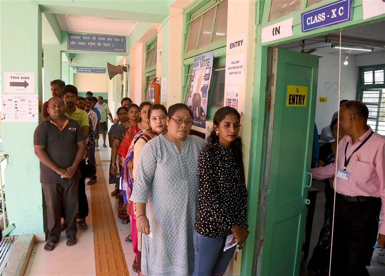 A voters standing in the queue to cast their votes, at a polling booth, during the 1st Phase of General Elections-2024 at Govt. Model Senior Secondary School Aberdeen Bazar, Port Blair, in Andaman and Nicobar Islands on April 19, 2024. 