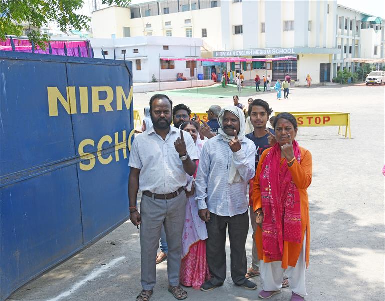 Voters showing a mark of indelible ink after casting their votes at a polling booth during the 1st Phase of General Elections-2024 at Nirmala English Medium School Kanchghar Chowk, East Ghamapur, Jabalpur, in Madhya Pradesh on April 19, 2024.