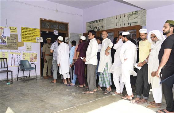 Voters standing in the queue to cast their votes, at a polling booth during the 1st Phase of General Elections-2024 at Munna Lal and Jai Narayan Khemka Girls College, in Saharanpur, Uttar Pradesh on April 19, 2024.