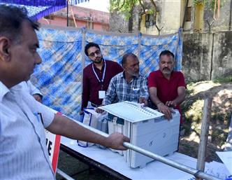 Polling officials checking the Electronic Voting Machine (EVMs) and other election related material required for the 2nd Phase General Elections-2024 at the Distribution Center Govt Girls Model Higher Secondary School Kandoli Nagrota, in Jammu on April 25, 2024.