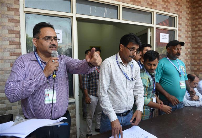 Polling officials distributing the Electronic Voting Machine (EVMs) and other election related material for the 2nd Phase General Elections 2024 at the Distribution Center MM College, in Jammu on April 25, 2024.