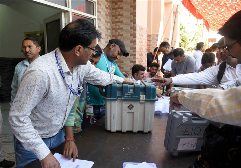 Polling officials distributing the Electronic Voting Machine (EVMs) and other election related material for the 2nd Phase General Elections 2024 at the Distribution Center MM College, in Jammu on April 25, 2024.
