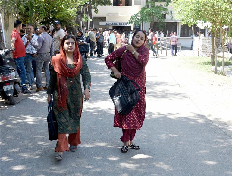 Polling officials carrying the Electronic Voting Machine (EVMs) and other election related material required for the 2nd Phase General Elections 2024 at the Distribution Center, MM College, in Jammu on April 25, 2024.