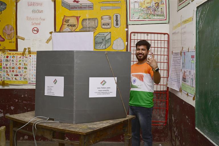 A voter casting his vote at a polling booth during the 2nd Phase of General Elections-2024 at Ucch Prathmik Vidyalaya, Meerut, in Uttar Pradesh on April 26, 2024.