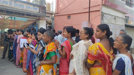 Female voters standing in queue to cast their votes at a polling booth during the IInd Phase of General Elections-2024 at Raiganj, in West Bengal on April 26, 2024.