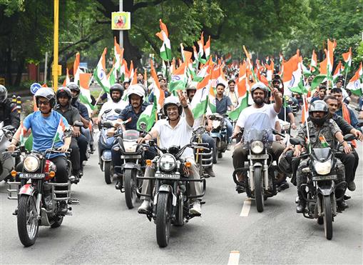 The Union Minister of Culture and Tourism, Shri Gajendra Singh Shekhawat and the Union Minister of Parliamentary Affairs and Minority Affairs, Shri Kiren Rijiju at the occasion of ‘Har Ghar Tiranga Bike Rally’ from Bharat Mandapam, in New Delhi on August 13, 2024.