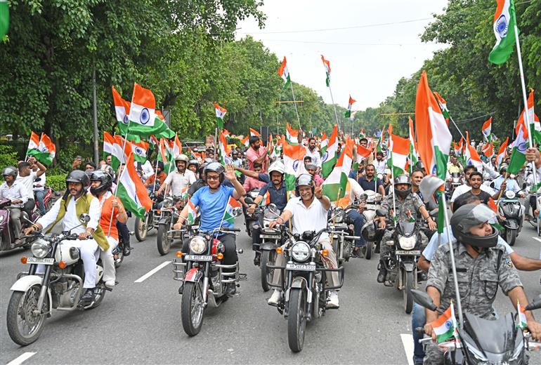 The Union Minister of Culture and Tourism, Shri Gajendra Singh Shekhawat and the Union Minister of Parliamentary Affairs and Minority Affairs, Shri Kiren Rijiju at the occasion of ‘Har Ghar Tiranga Bike Rally’ from Bharat Mandapam, in New Delhi on August 13, 2024.