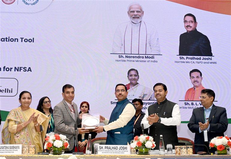 The Union Minister for Consumer Affairs, Food and Public Distribution & New and Renewable Energy, Shri Pralhad Joshi at the launch of Anna Chakra, a PDS Supply Chain Optimisation Tool and SCAN portal subsidy claim application for the National Food Security Act, NFSA, in New Delhi on December 05, 2024. The Minister of State for Consumer Affairs, Food and Public Distribution and Social Justice and Empowerment, Shri B. L. Verma and the Minister of State for Consumer Affairs, Food and Public Distribution, Smt. Nimuben Jayantibhai Bambhaniya are also present.