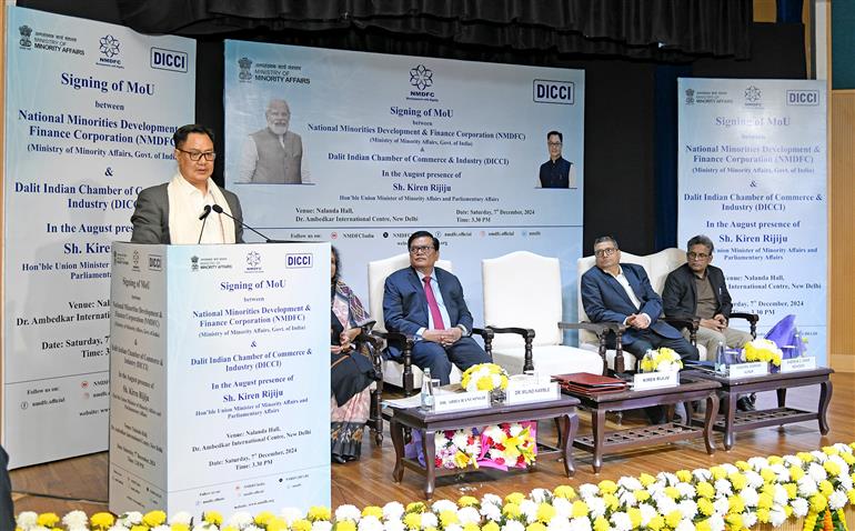 The Union Minister of Parliamentary Affairs and Minority Affairs, Shri Kiren Rijiju addressing the gathering during the Signing a Memorandum of Understanding (MoU) ceremony between National Minorities Development & Finance Corporation (NMDFC) and Dalit Indian Chamber of Commerce & Industry (DICCI) at Dr. Ambedkar International Centre, in New Delhi on December 07, 2024.