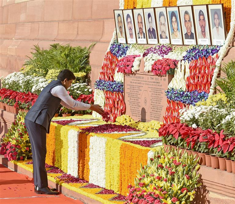 The Minister of State for Rural Development and Communications, Dr. Chandra Sekhar Pemmasani pays floral tribute to martyrs of the 2001 Parliament attack at Parliament House, in New Delhi on December 13, 2024.