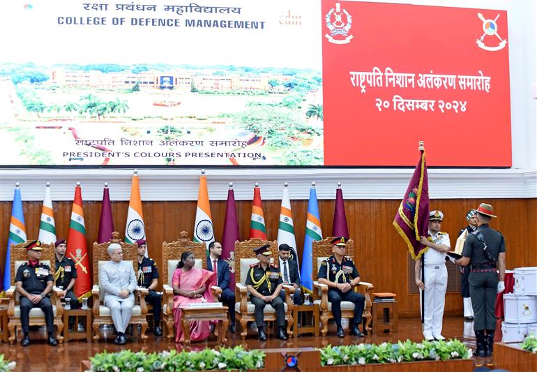 The President of India, Smt. Droupadi Murmu presents the Colours to the College of Defence Management during the Presidential Colours Investiture Ceremony at Secunderabad, in Hyderabad on December 20, 2024.