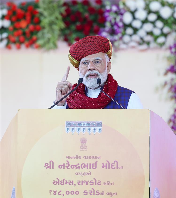 PM addressing at foundation stone laying of multiple development projects at Rajkot, in Gujarat on February 25, 2024.