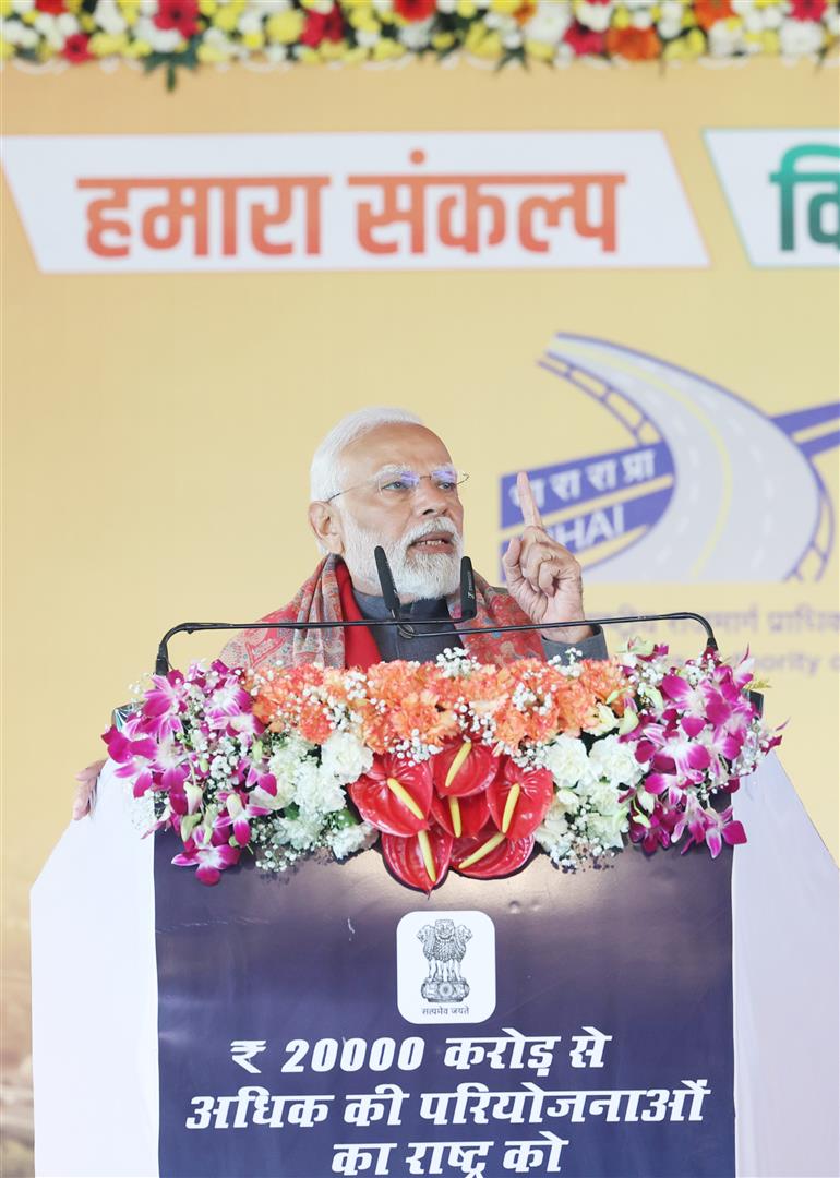 PM addressing the gathering at the inauguration and laying the foundation stone of various development projects at Bulandshahr, in Uttar Pradesh on January 25, 2024.