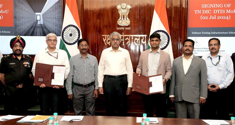 The Defence Secretary, Shri Giridhar Aramane witnessing the signing of MoU between senior officials of Ministry of Defence (MoD) and Tamil Nadu Industrial Development Corporation Limited to set up testing facilities in Unmanned Aerial System (UAS), Electronic Warfare (EW) & Electro Optics (EO) domains in Tamil Nadu Defence Industrial Corridor under the Defence Testing Infrastructure Scheme (DTIS), in New Delhi on July 02, 2024.