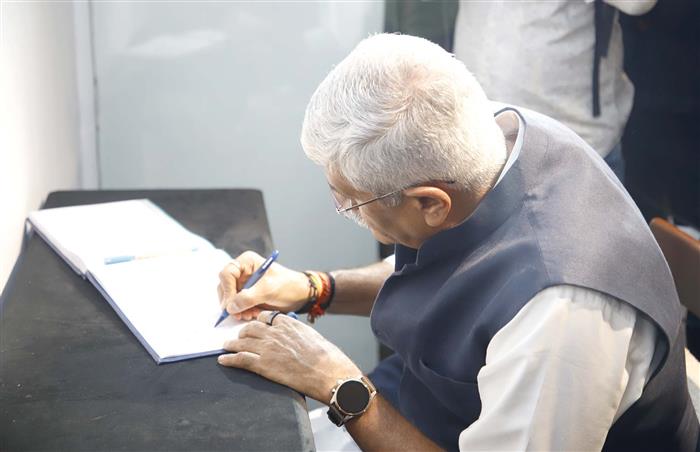The Union Minister of Culture and Tourism, Shri Gajendra Singh Shekhawat signing the visitor book at National Museum, in New Delhi on July 11, 2024.