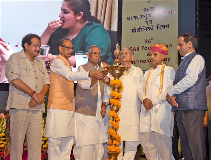 The Union Minister of Agriculture and Farmers Welfare and Rural Development, Shri Shivraj Singh Chouhan lighting the lamp at the inauguration of the 96th ICAR Foundation and Technology Day 2024 at Bharat Ratna C. Subramanian Convention Center, NASC Complex, in New Delhi on July 16, 2024. The Union Minister of Panchayati Raj and Fisheries, Animal Husbandry and Dairying, Shri Rajiv Ranjan Singh alias Lalan Singh, the Ministers of State for Agriculture and Farmers Welfare, Shri Bhagirath Choudhary and Shri Ram Nath Thakur and the Minister of State for Fisheries, Animal Husbandry and Dairying and Panchayati Raj, Prof. S.P. Singh Baghel are also seen.