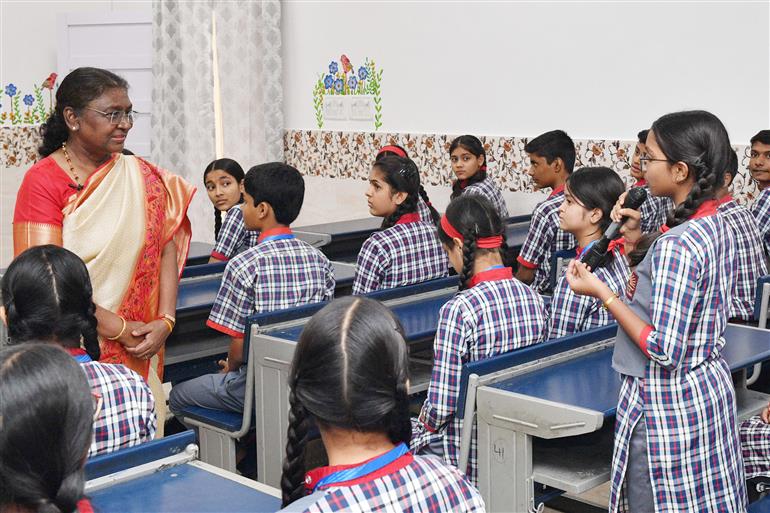 The President of India, Smt Droupadi Murmu interacting with the students of Class IX of Dr. Rajendra Prasad Kendriya Vidyalaya on the completion of 2 years of Presidency at Rashtrapati Bhavan, in New Delhi on July 25, 2024.
