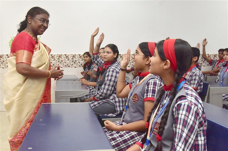 The President of India, Smt Droupadi Murmu interacting with the students of Class IX of Dr. Rajendra Prasad Kendriya Vidyalaya on the completion of 2 years of Presidency at Rashtrapati Bhavan, in New Delhi on July 25, 2024.