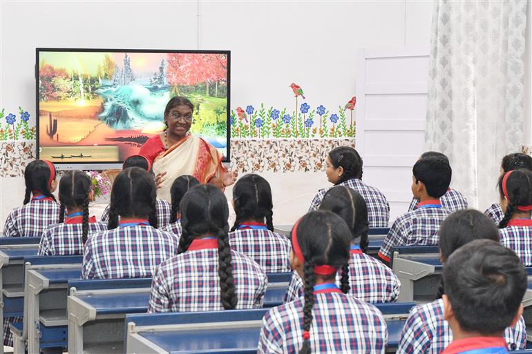 The President of India, Smt Droupadi Murmu interacting with the students of Class IX of Dr. Rajendra Prasad Kendriya Vidyalaya on the completion of 2 years of Presidency at Rashtrapati Bhavan, in New Delhi on July 25, 2024.