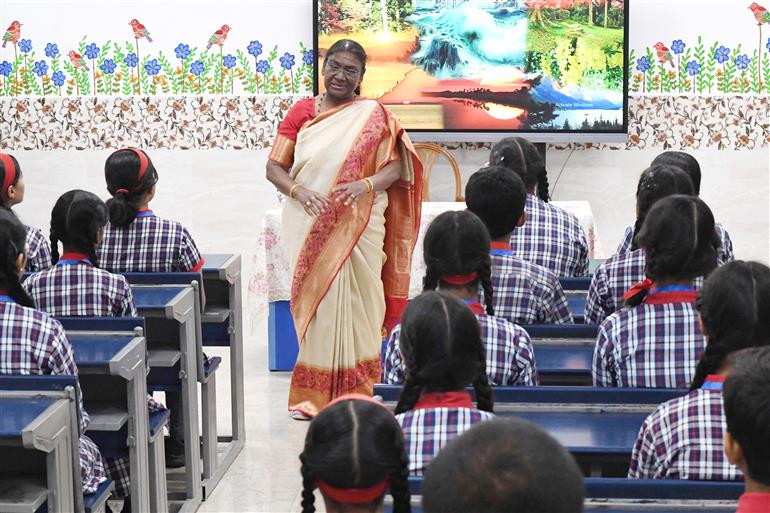 The President of India, Smt Droupadi Murmu interacting with the students of Class IX of Dr. Rajendra Prasad Kendriya Vidyalaya on the completion of 2 years of Presidency at Rashtrapati Bhavan, in New Delhi on July 25, 2024.