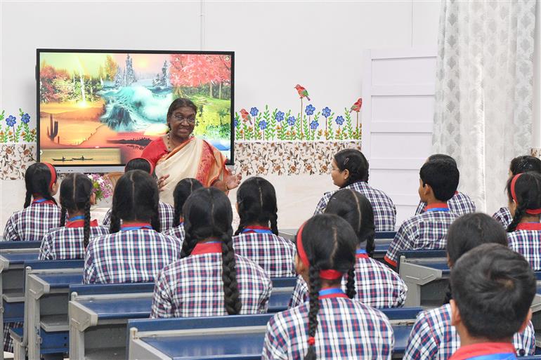 The President of India, Smt Droupadi Murmu interacting with the students of Class IX of Dr. Rajendra Prasad Kendriya Vidyalaya on the completion of 2 years of Presidency at Rashtrapati Bhavan, in New Delhi on July 25, 2024.
