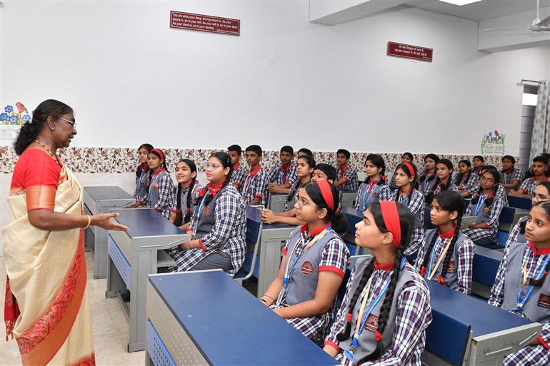 The President of India, Smt Droupadi Murmu interacting with the students of Class IX of Dr. Rajendra Prasad Kendriya Vidyalaya on the completion of 2 years of Presidency at Rashtrapati Bhavan, in New Delhi on July 25, 2024.