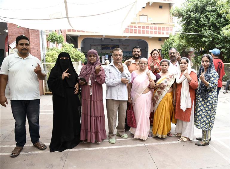 Voters showing mark of indelible ink after casting their votes at a polling booth during the 7th Phase of General Elections-2024 at Bipin Bihari Chakravarti Kanya Vidyalaya Inter College, Ramapura, in Varanasi, Uttar Pradesh on June 01, 2024.