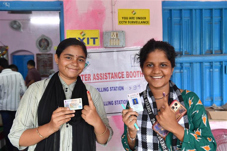 Female voters showing mark of indelible ink after casting their votes at a polling booth during the 4th Phase of General Elections-2024 at NGO Hall, Gate Bazar  in Berhampur, Odisha on May 13, 2024.