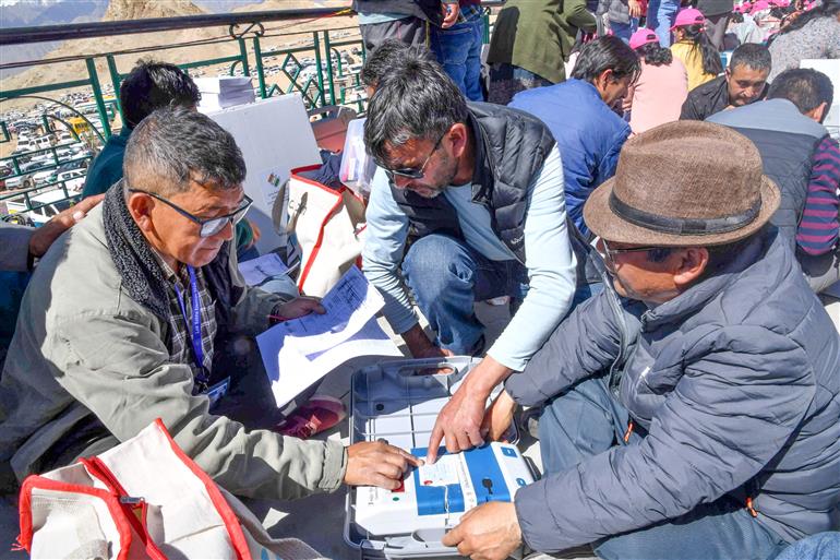 Polling officials are checking Electronic Voting Machine (EVMs) and other election related material required for the 5th Phase of General Elections-2024 at Sindhu Sanskriti Kendra, in Leh on May 19, 2024.