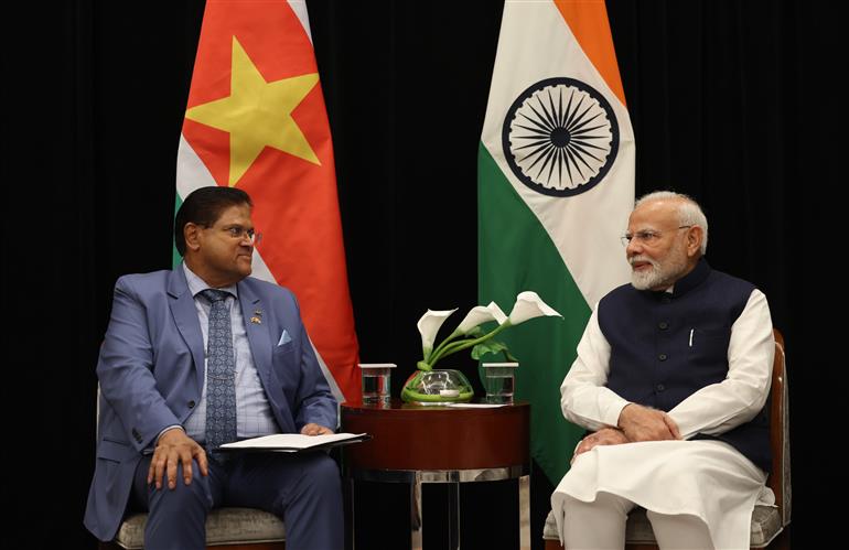 PM in a bilateral meeting with the President of Suriname, Mr. Chandrikapersad Santokhi at Georgetown, in Guyana on November 20, 2024.