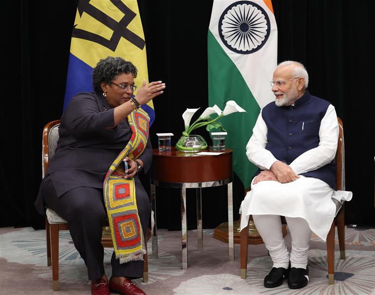 PM in a bilateral meeting with the Prime Minister of Barbados, Ms. Mia Amor Mottley at Georgetown, in Guyana on November 20, 2024.